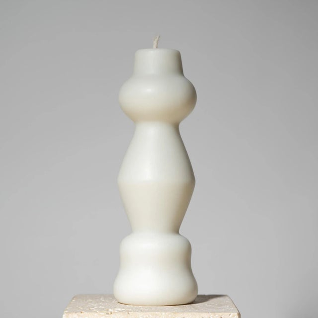 Hand-poured sculptural pillar candle inspired by postmodern design, made with 100% USA beeswax and a cotton wick. This...