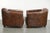 This set of 2 sheepskin Aviator design armchairs features a warm brown color with a beautiful patina. The armchair is a...