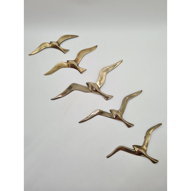 A striking set of five brass wall-mounted seagulls crafted in the distinctive modernist style of the 1960s and 1970s. The...