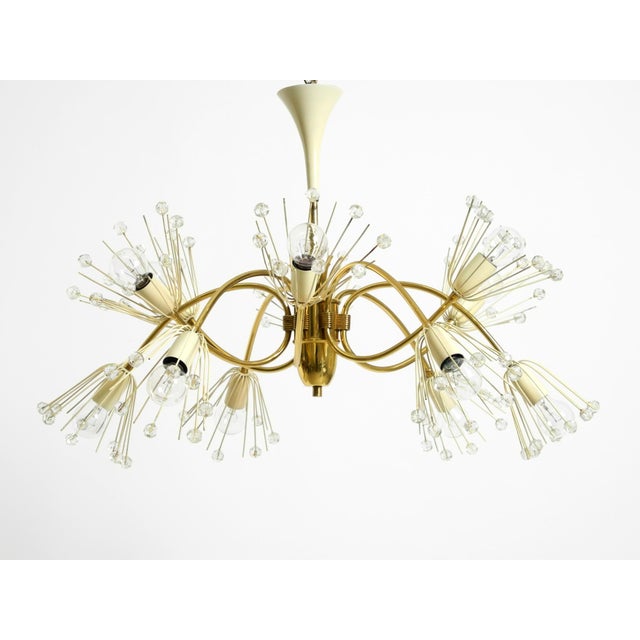 Beautiful Mid-Century Modern brass chandelier. Manufactured by Rupert Nikoll. Made in Austria. Stunning, elaborate design...
