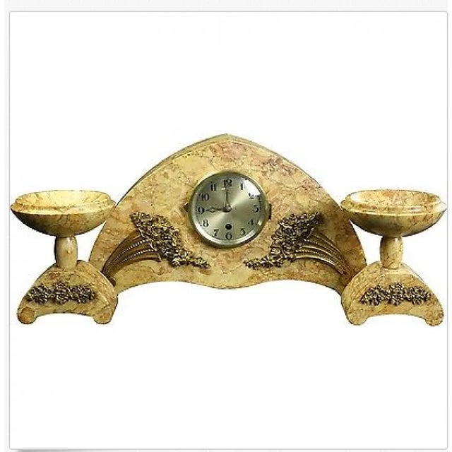 French art deco marble clock garniture set comprising of: (1) variegated marble clock with gilt metal mountings and arched...