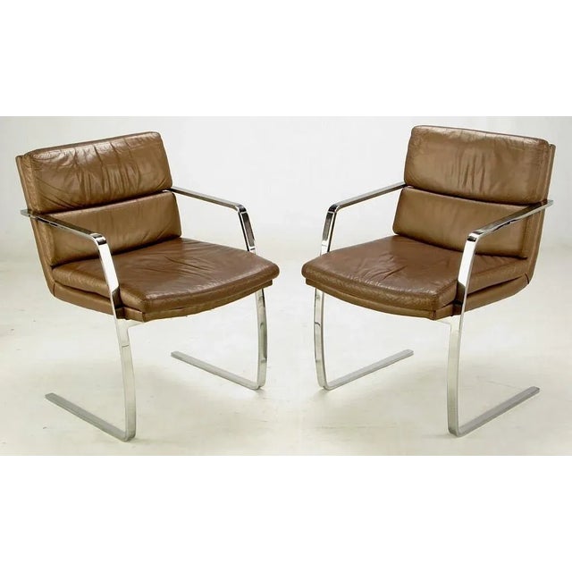 Pace Collection chrome flat bar and mocha leather arm chairs. Superior build quality with heavy chrome-plated flat bar...