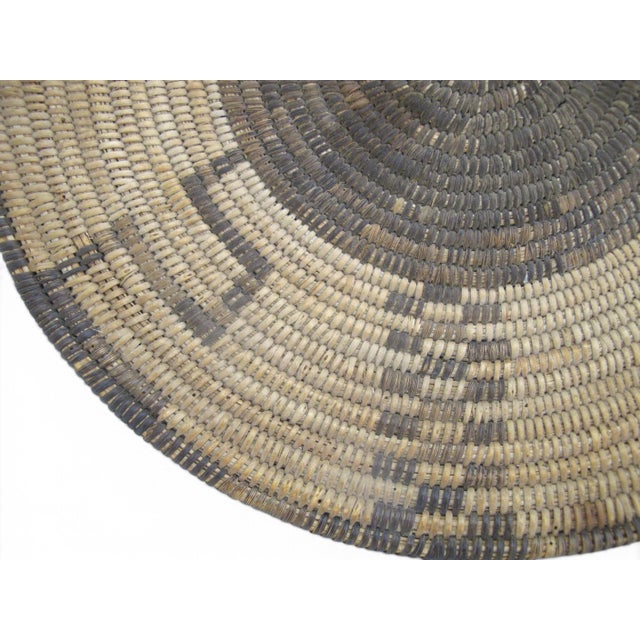 Native American hand coiled basket tray likely Akimel O'odham (Pima) or Tohono O'odham (Papago)—featuring a dark woven...