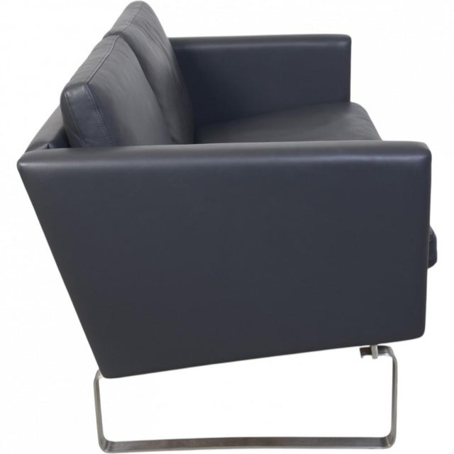 Hans Wegner CH103 2.seater sofa upholstered in original grey leather and with a steel frame. The sofa is from the 2000s...