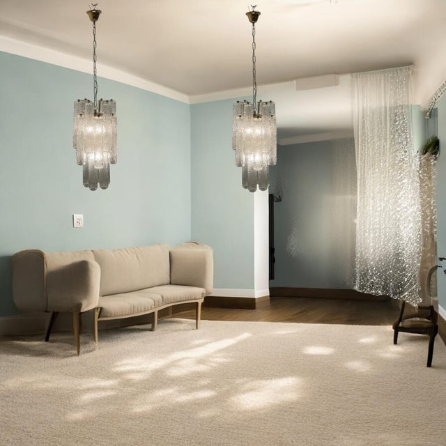 Set of 2 Murano Glass Tube Chandeliers Attributed to Toni Zuccheri, Italy, 1970s This elegant pair of 1970s chandeliers,...