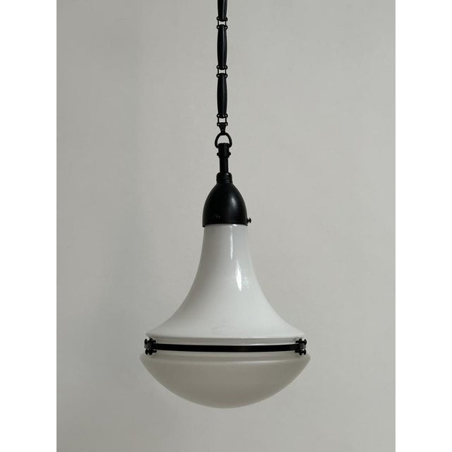 - An original and rare Luzette pendant light by Peter Behrens for AEG, German circa 1920. - Two tone glass with copper...