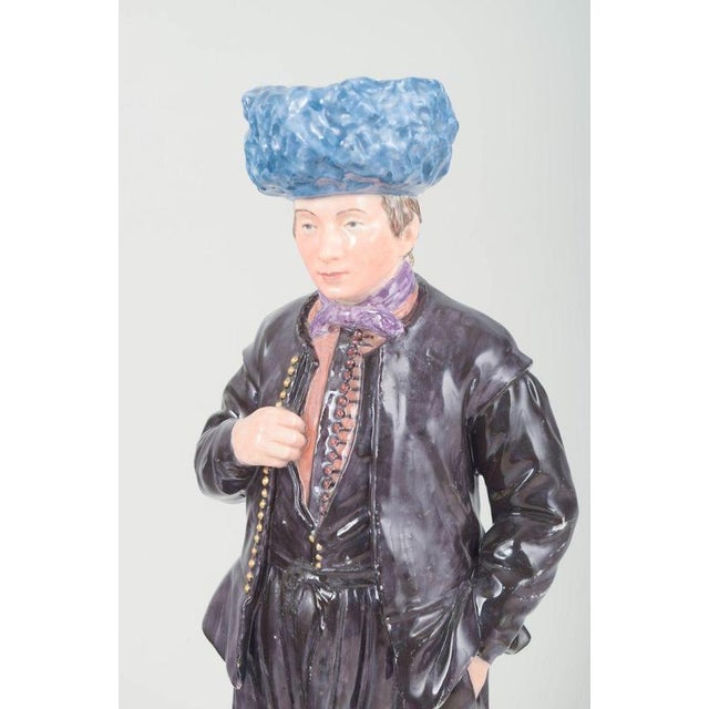 Royal copenhagen porcelain figure “dirch jan isbrandtsen”, early 20th century. Hand-painted overglaze figure depicting a...