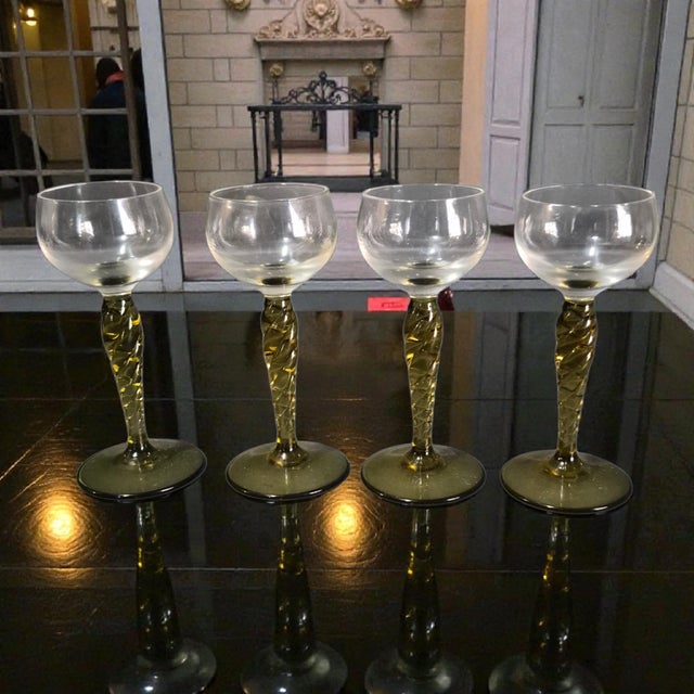 The Vintage Four Venetian Hand Blown Twisted stem Olive Green Glass Liquor Glasses are a set of elegant cordial glasses...