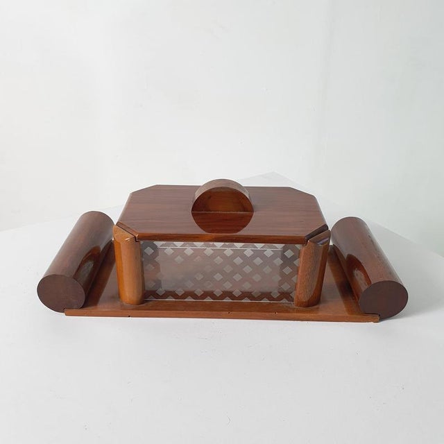 A box in from the 1930's in Art Deco style made from wood and etched glass. The glass is possible to lift off to clean....
