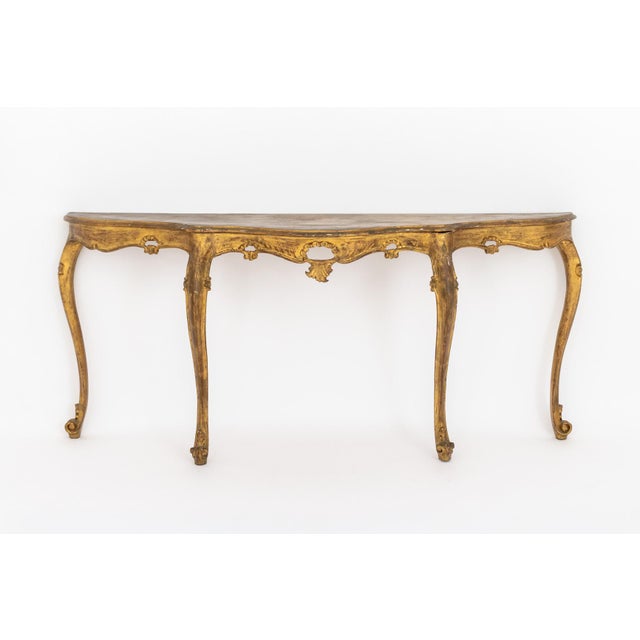 Italian Louis XV Style Giltwood Console, serpentine-form top over cabriole legs, with paper label "Made in Italy"...