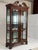 This is an elegant Georgian style mahogany display cabinet by Henkel Harris, finely crafted in the United States with a...