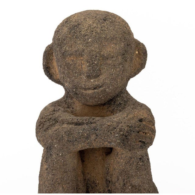 Costa Rican Seated Nude Male Figure Carved Volcanic Stone Sculpture. 10.25" H x 5 W x 5.25 D. Provenance: From a New York...