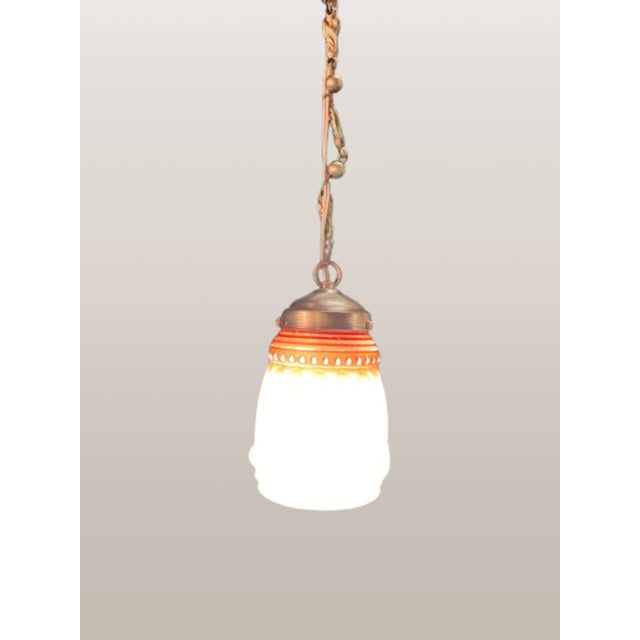 This is a unique art deco pendant light with a striking bisque glass shade. This means the glass is frosted and resembles...
