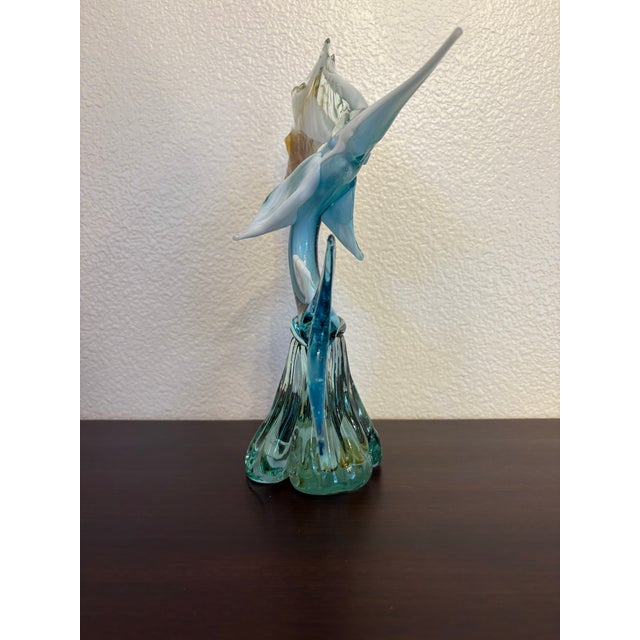 This blue, white and brown Murano vintage swordfish sculpture stands 11” tall and is 9 inches wide by 4 inches deep. This...