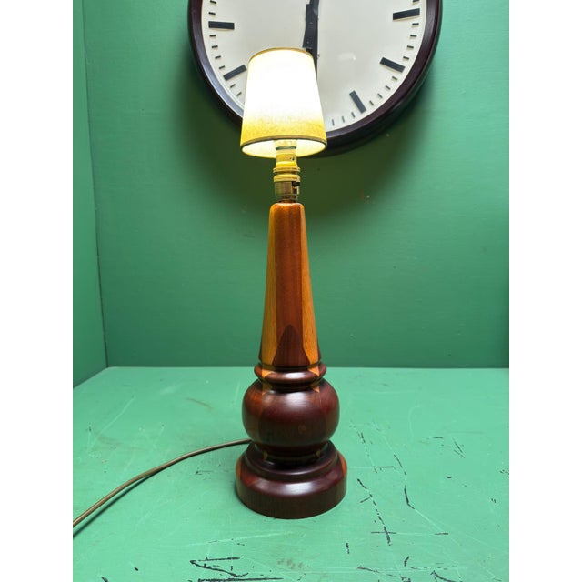 Mid century 1960s turned teak table - bedside lamp. Comes with a clip on shade which clips onto the bulb & can be...