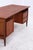 Vintage boomerang-shaped desk made of teak with a beautiful grain and a clean, balanced form. On the right are two...
