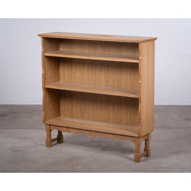 A beautiful small oak bookcase from Denmark, dating from the 1970s and showcasing the bold character of the Brutalist...