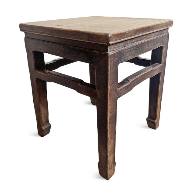 Vintage hand carved square elm wood side table. Aged medium walnut stained legs with natural wood top. Beautiful modern...