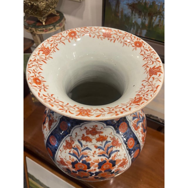 Tall Japanese Imari Temple Jar with all-over Floral Design, 19th Century. Rosewood stand included