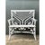 This vintage rattan bench is a showpiece of ornate, Victorian-inspired wickerwork, finished entirely in soft white paint....