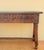 Elegant Spanish console table crafted in walnut and featuring two richly carved drawers with striking geometric motifs and...