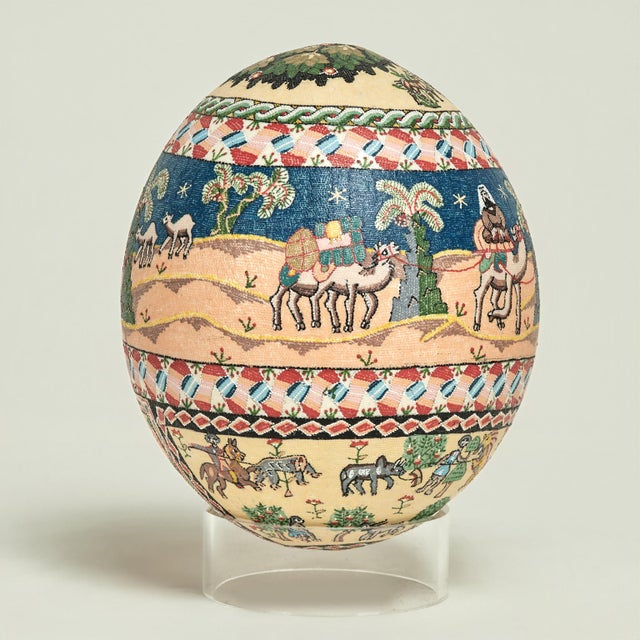 Transporting vintage Moroccan ostrich egg hand decorated with figures, animals and trees executed in classic Moorish style...