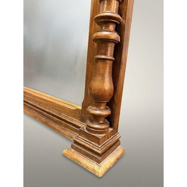 This impressive late 19th century Belgian Mechelen wall mirror features a masterfully hand carved solid oak frame flanked...