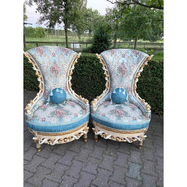 This striking pair of circa 1970 Louis XVI–style throne chairs combines dramatic proportions with elegant neoclassical...