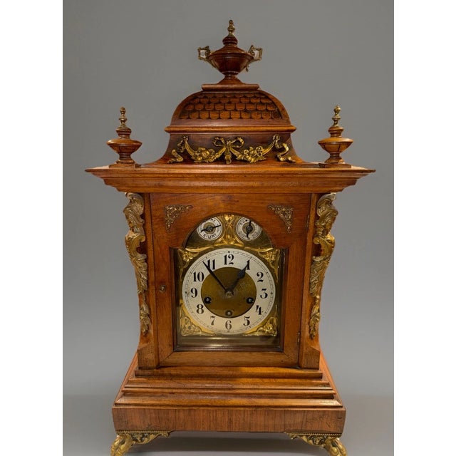 This listing is for a large antique German bracket mantel clock by Junghans. This clock has a gorgeous wooden case with...