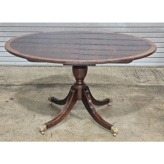 Stickley Oval Federal Style Mahogany Dining Table W 2 Leaves Brass Paw Feet Table features an oval Mahogany table top with...