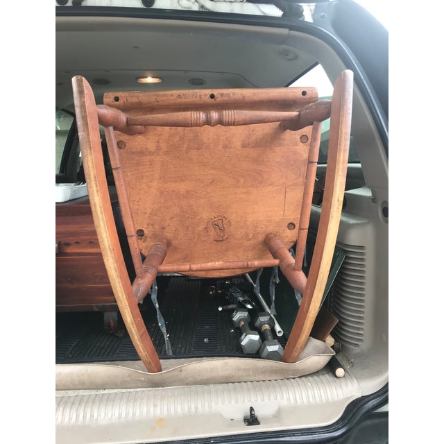 Solid wood rocking chair. The seat is 15” from the ground. This chair is made by Nichol and Stone co. From gardener mass.