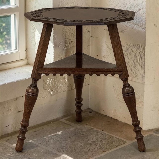 An imaginative English antique table whose unusual nine sided top gives the piece a distinctive presence from every angle....