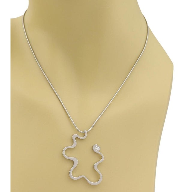 Crafted by the legendary Tiffany & Co. and designed by the acclaimed architect Frank Gehry, the Equus Diamond Pendant...