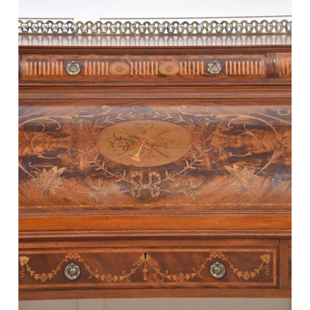 A substantial Sheraton Revival flame mahogany and satinwood crossbanded cylinder bureau, the ornate raised gallery over...