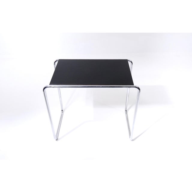 The "Model B9" side table is a design by the German-American architect and designer Marcel Breuer (1902-1981). Breuer...