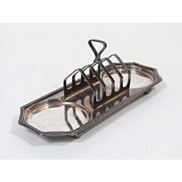 An antique English silverplate breakfast server by Cheltenham & Company Ltd., marked on the underside “Cheltenham and...