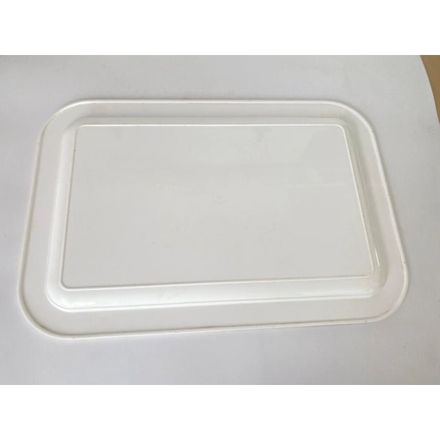 This tray or platter is from France. It has been made in the 1970s. White yellow and grey Color. Plastic.