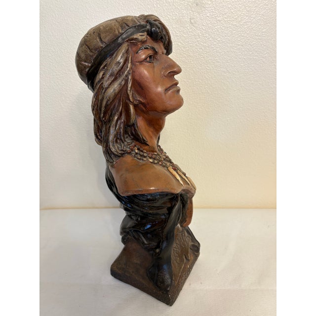This striking vintage countertop bust depicts the Native American figure "Hiawatha" hand scribed along the base....
