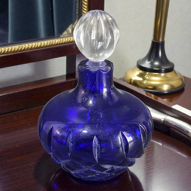 This Vintage Bohemian Cobalt Blue Cut Crystal Perfume Bottle is a unique and elegant decorative collectible. Made in the...