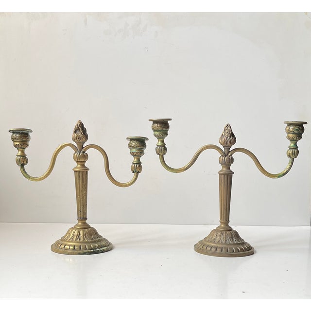 In the style of Louis XIV comes this elegant pair of antique French Candelabras. Hand-made in France during the early 20th...