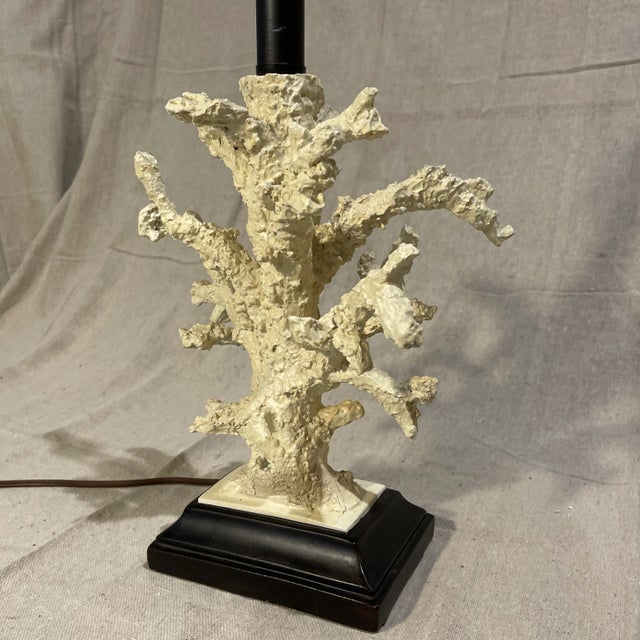 Unique Faux Coral Decorator Lamp. Off white coral mounted on a black base with decorative edge. Complete with a harp and...