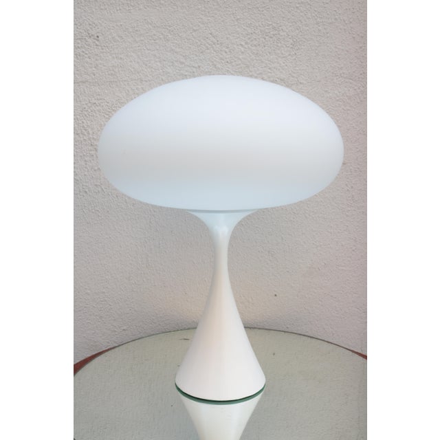 A modernist table lamp by Laurel. Enameled metal and frosted glass shade.