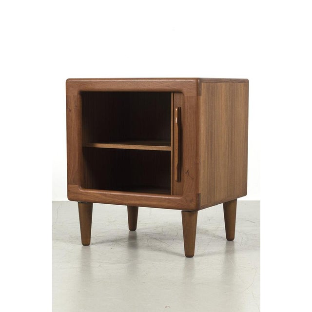 Nice vintage cabinet from Denmark made of teak veneer. The cabinet has 1 beautiful tambour sliding door with nice handle....