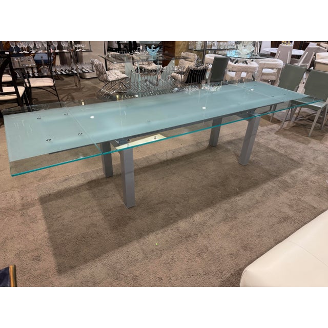 This sophisticated dining set by Cattelan Italia embodies Italian modern design with clean lines, refined materials, and a...