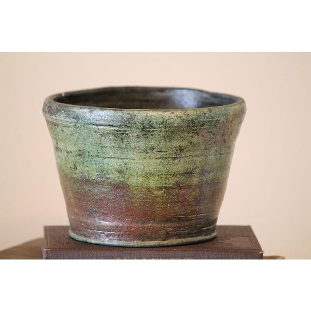 This is a gorgeous pottery planter in Raku style that can be used indoor or out. Each side of this planter has a different...