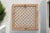 A bleached wood window panel with a see-through cross weave design. Originally lattice window panels were used to let air...
