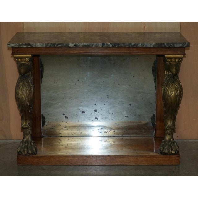 Regency, hand carved Rosewood, Giltwood console table with thick green marble top and eagle pillared legs sitting on claw...