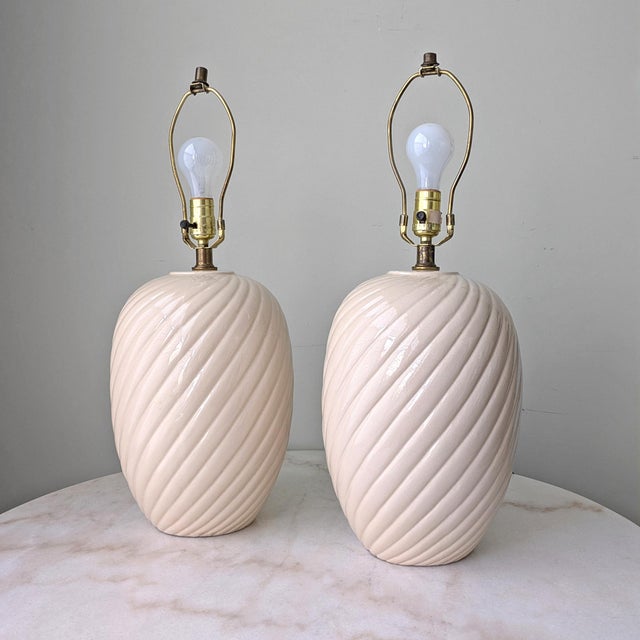 A pair of vintage large ceramic table lamps by Westcal. Original wiring is tested and working. Measurements: 10ʺL × 10ʺD ×...