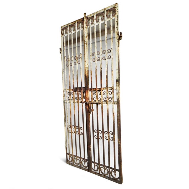 Vintage tall iron gates from India with beautiful aged finish. Great used indoors or out. Iron will continue to age over...