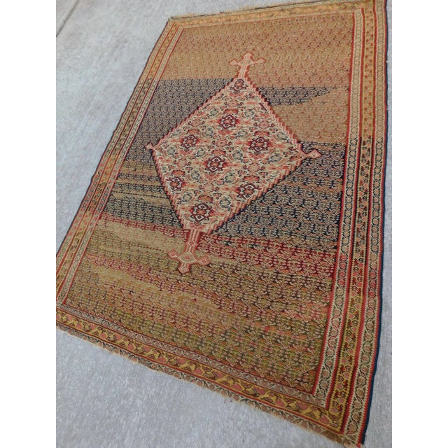 Ivory medallion Flanked on both sides. Field with stylized paisly. 4'4"x 6'8"